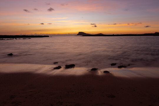 A beautiful sunset full of colors on Murdeira Beach, which is a quiet, scenic sandy and rocky cove located on the sheltered west coast of Sal Island, Cape Verde. The beach is located inside a protecte
