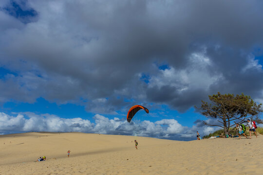 People paragliding at the Dune of Pilat