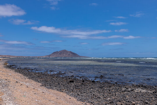 The beautiful beach of Ponta Preta (English translation: Black Beack) is a tranquil part of Sal Island in Cape Verde without many tourists but with a perfect golden sand beach and turqiouse water crea