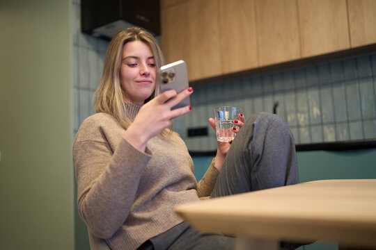 Warm phone scrolling moment with easy calm presence