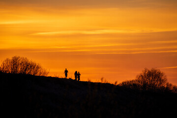 Fototapeta premium silhouette of a man walking on a sunset