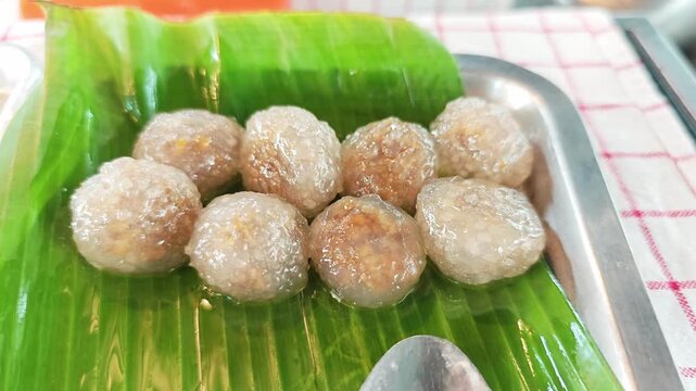 Freshly steamed Thai sago dumplings with translucent tapioca pearls.
