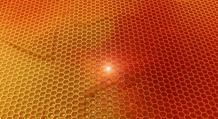 Obraz premium Close-up of a golden honeycomb pattern with a light flare, symbolizing nature, structure, and sweetness, perfect for organic or energy concepts.