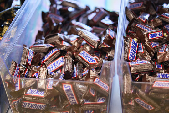 Tyumen, Russia-March 20, 2026: Snickers chocolate candies with shallow depth of field, highlighting the iconic logo