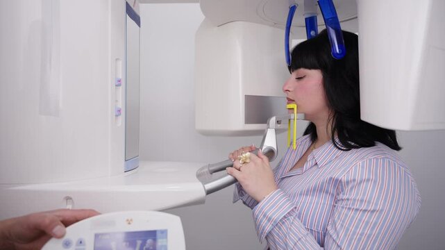 Woman undergoing panoramic dental x ray scan