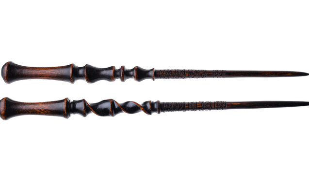 Dark wooden magic wands with intricate carvings and silver details