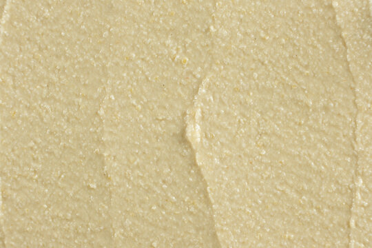 Macro texture of smooth creamy hummus top view