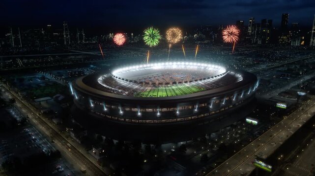 Football Championship Stadium Hosts a Soccer Match at Night With a Packed Crowd and Audience, Fireworks Exploding at Final Cup as a World Sport Event and Decisive Game Start. Aerial Wide Shot.