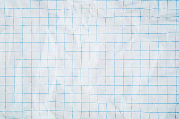 Obraz premium White squared paper texture with blue grid pattern and wrinkled folded surface backdrop