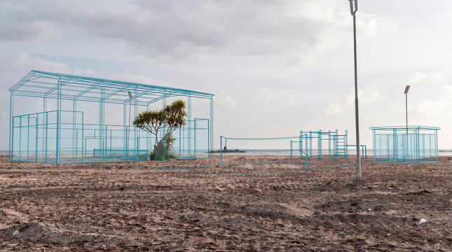 Outdoor gym pavilion wireframe over coastal reclamation site with calisthenics equipment schematic