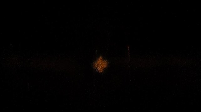 Dark nightline skyline with distant jet trail silhouette