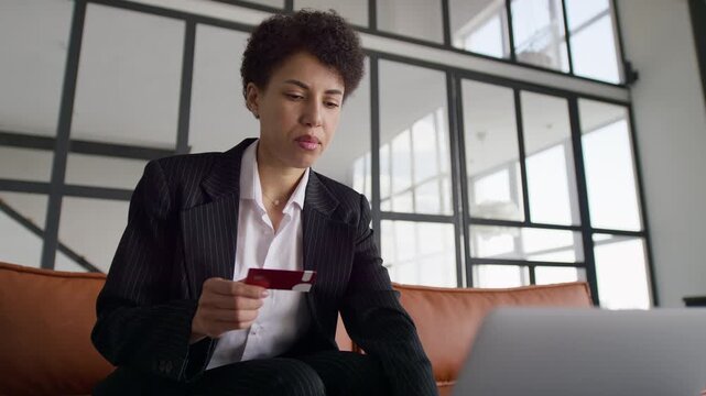 Businesswoman entering credit card details online
