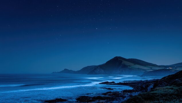 Bioluminescent Ocean Waves Crash on Rocky Shoreline Under Starry Night Sky.