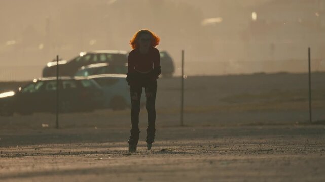 Young woman inline skating during sunset