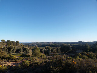 Obraz premium Panoramic landscape with blue sky and forest hills in Spain