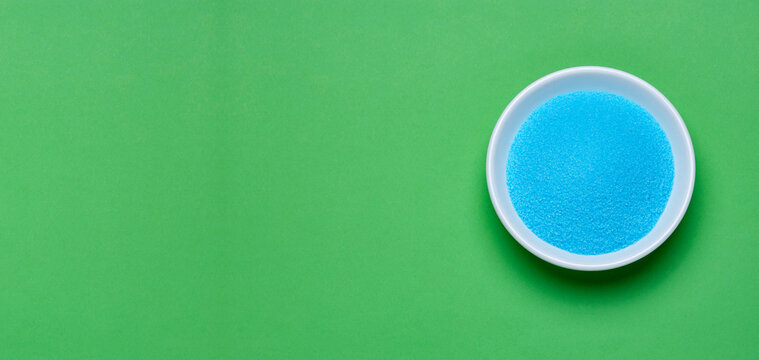 Bright blue copper sulfate in a bowl - Blue sea salt