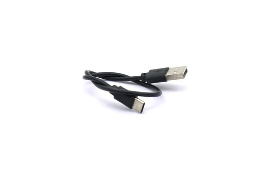 A black USB cable on a white background. A USB cable for data transfer.