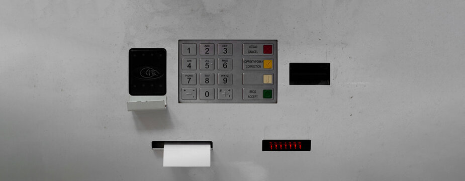 Street photo banner. Gray ATM machine with panel with keyboard, contactless reader, numbers button. Concept of credit, loan, debt, pay tax, plastic card, budget, cash money, debit, wages. Copy space