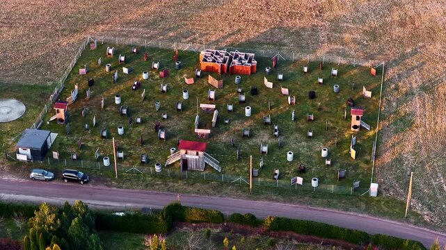 Paintball field prepared for game play, featuring numerous targets and obstacles for strategy