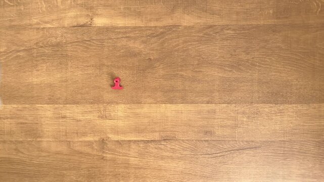 Child's Hand Picking Up One of Two Small Paper Clips, 4K Slow Motion