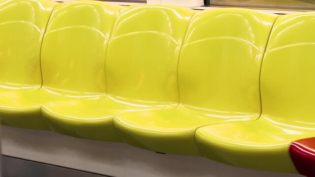Modern plastic seats in metro carriage interior vandal resistant seating train