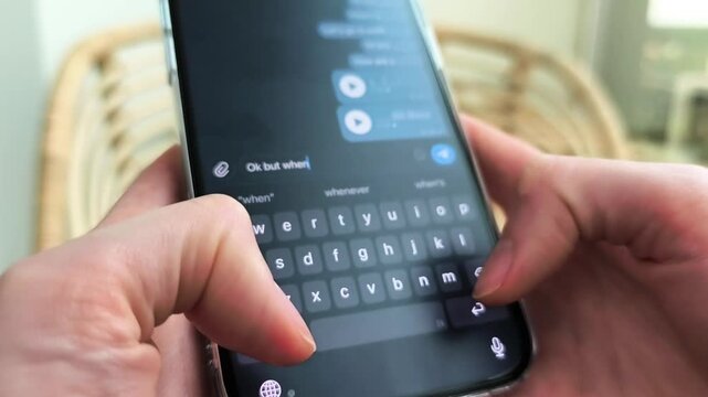 Hands type a message on smartphone in close up. Mobile chat input progresses across the screen. Digital communication and texting concept for social media and messaging apps..