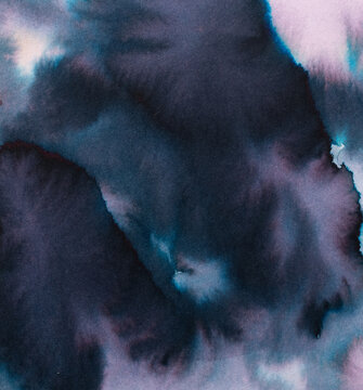 Abstract watercolor paints blending and bleeding on paper, creating a fluid backdrop with deep blue, purple, and black tones merging into a textured, ethereal wash for creative projects