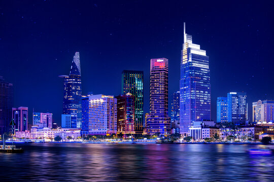 Coastline with skyscrapers of Ho chi minh or Saigon city in Vietnam, night panorama