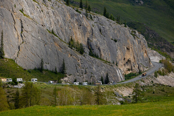 Obraz premium Scenic road amidst Altai mountains, Russia with camper vans