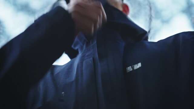 Closing Jacket Zipper in Rain &ndash; Outdoor Storm Preparation Close Up