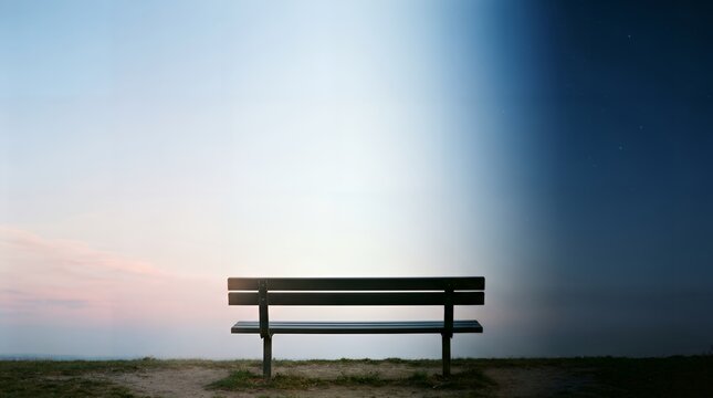 Empty Park Bench Against a Gradient Sky of Day and Starry Night
