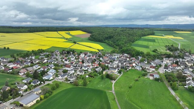 Aerial View of Ketternschwalbach near H&uuml;nstetten with Rapeseed Fields in Hesse, Germany