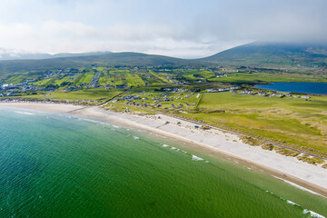 Obraz premium Aerial view of Keel Beach on Achill Island, County Mayo, Ireland. Turquoise Atlantic water, white sand and low cloud along the Wild Atlantic Way.