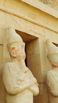 Statues of Osiris. Hatshepsut Funeral Temple in Luxor. A historical landmark of Ancient Egypt during the time of the pharaohs. Vertical video.