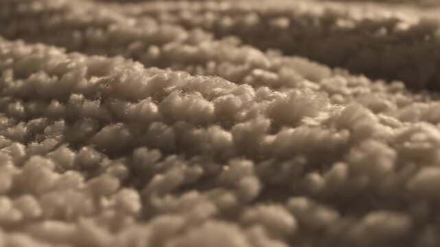 Macro shot of a high-quality, plush blanket showing the intricate, soft fibers.