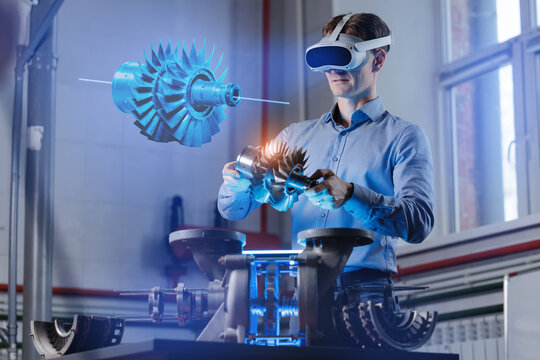 Caucasian male engineer using vr for advanced engine design in futuristic workspace, Immersive Technology with AI assistant