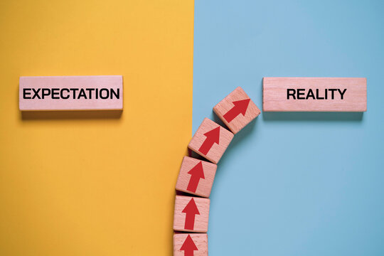 Expectation versus reality concept with wooden text blocks on contrasting backgrounds, symbolizing perception gap, business challenges, social media illusion and real life comparison