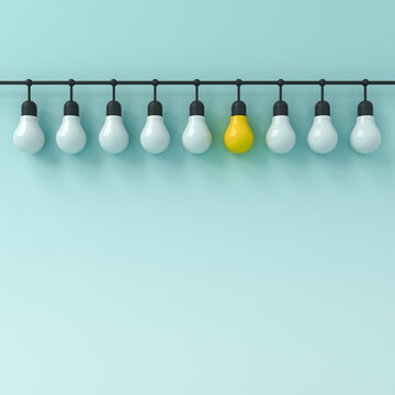 Standing out from the crowd and leadership one hanging yellow bright idea bulb with other dim white bulbs on light blue green cyan pastel color background business creative idea concepts 3D rendering