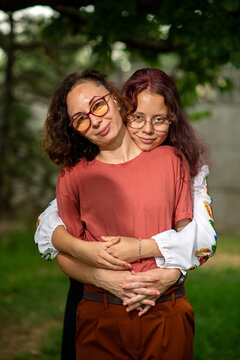 Mother and Daughter Embrace Outdoors