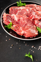 Fototapeta premium Raw pork steak pork tenderloin, food preparation lunch or dinner tasty organic snack fresh farm product delicious gourmet food background on the table rustic food, top view copy space