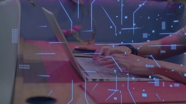 Man typing on laptop, fingers starting blue circuit overlay, growing then fading while working tech