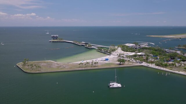 High aerial drone shot pushing toward St Pete Pier and waterfront beach