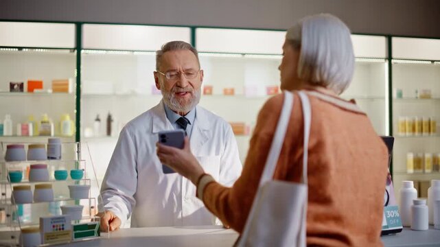 Customer displaying smartphone pharmacist closeup. Shopper requesting pills