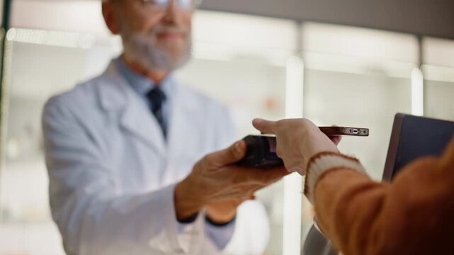 Pharmacist hands giving terminal machine providing payment in cashier closeup
