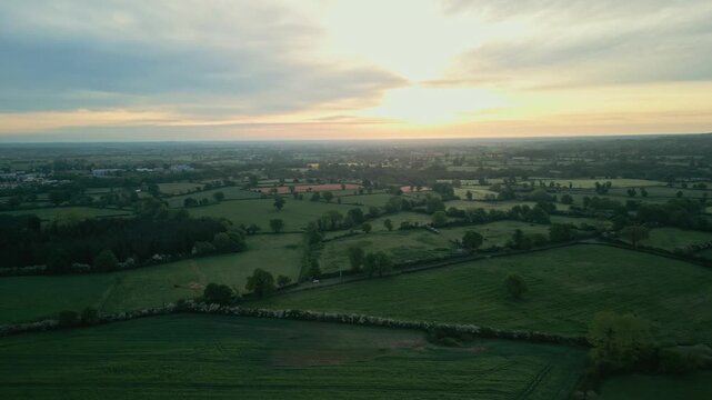 Peaceful countryside drone view with fields at golden hour