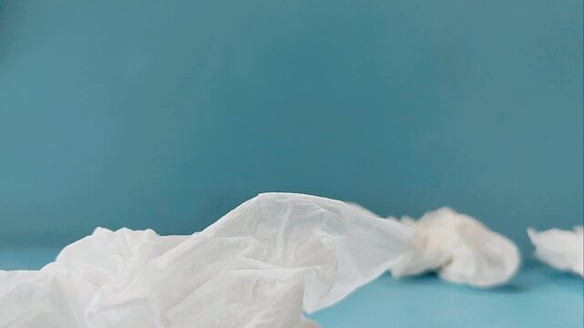discarded tissue trash over blue background