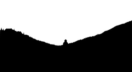 Obraz premium Black and white silhouette of a person in a mountain valley