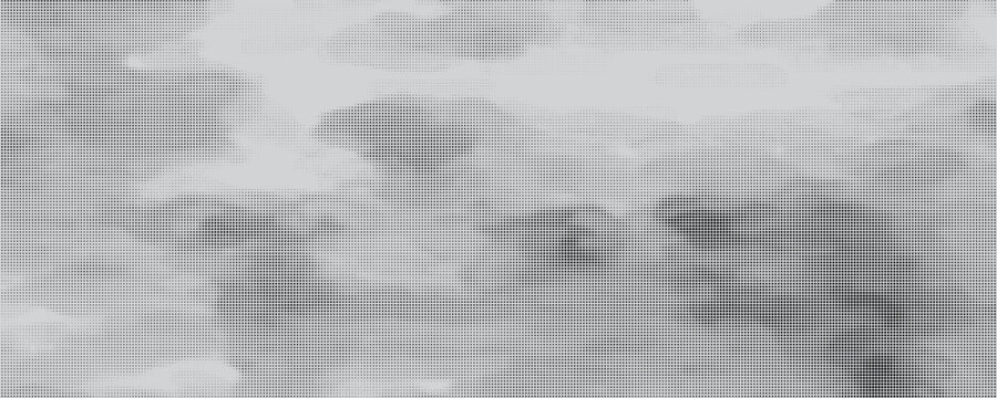 A high-contrast halftone dot pattern transitioning smoothly from black to white, creating a bold and eye-catching abstract texture.