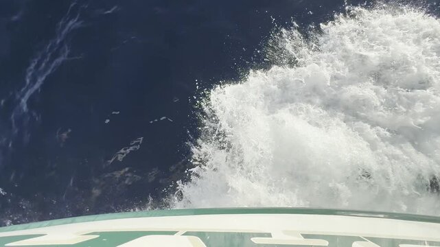 Bow wake of moving boat transition to the sun