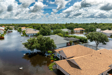 Naklejka premium Flooded residential area with underwater houses from hurricane Debby rainfall water in Laurel Meadows community in Sarasota, Florida. Aftermath of natural disaster in southern USA